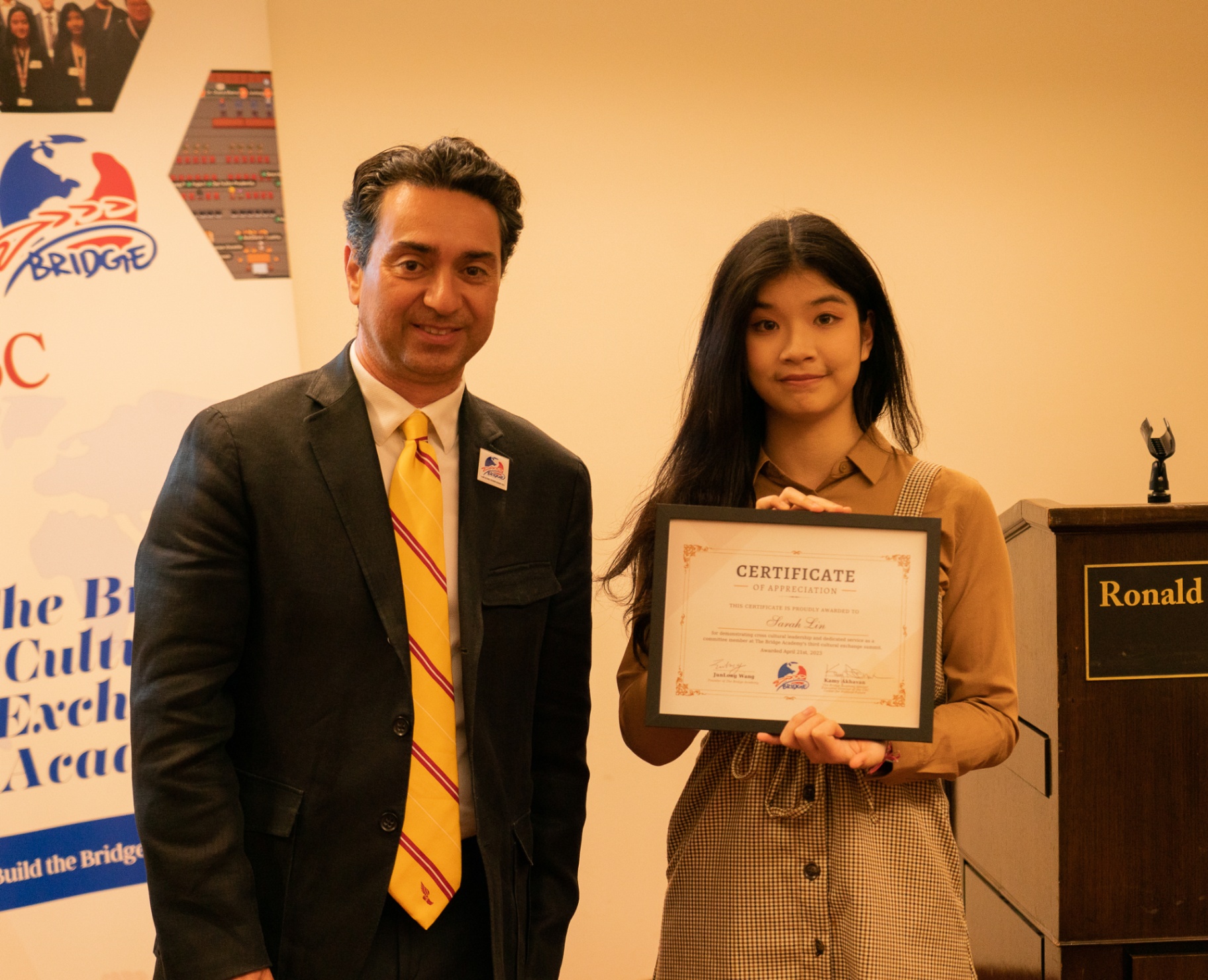 Young BCEA committee member receiving recognition at the summit