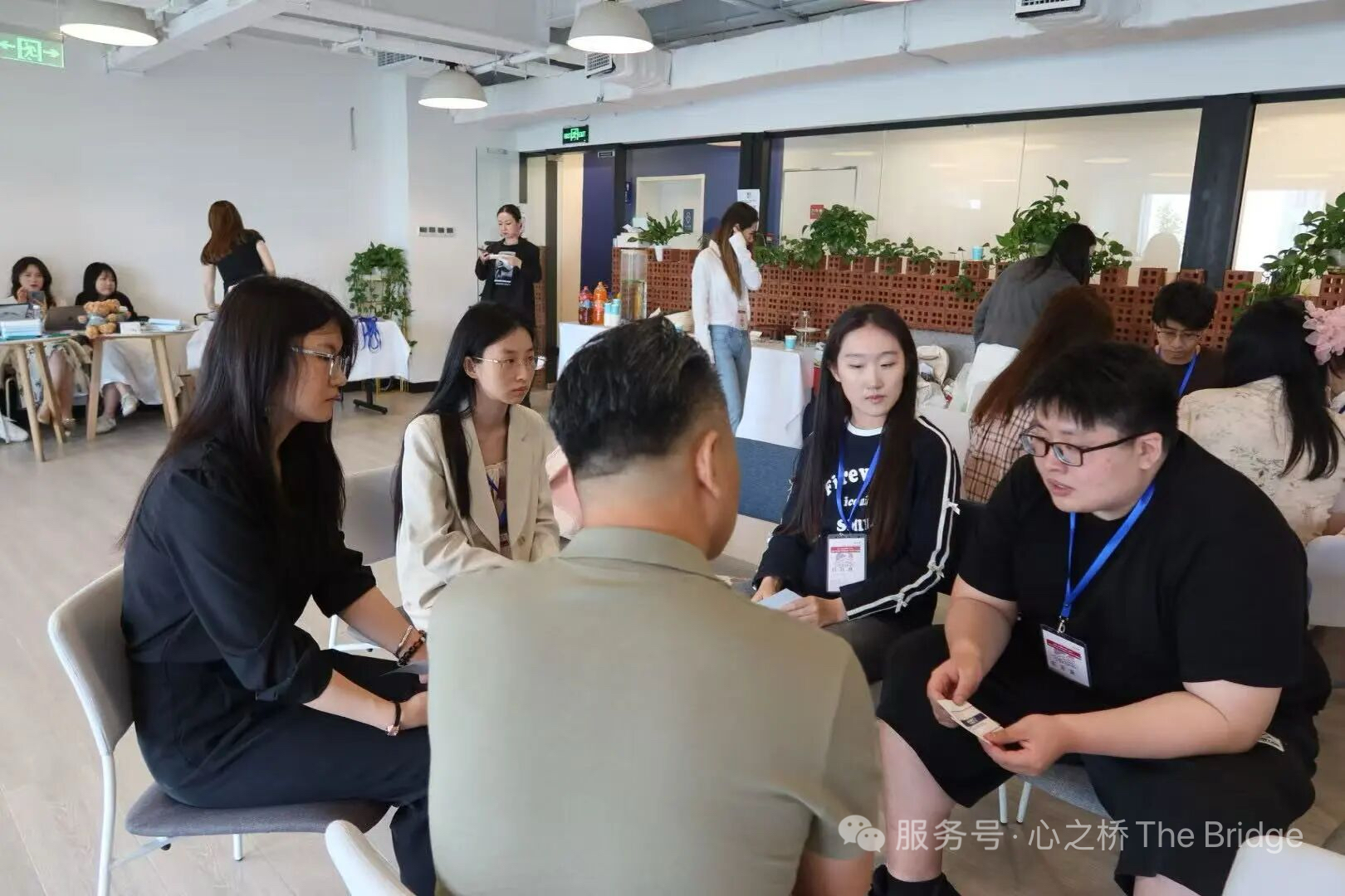 Small-group dialogue circle of student delegates during the Beijing summit.